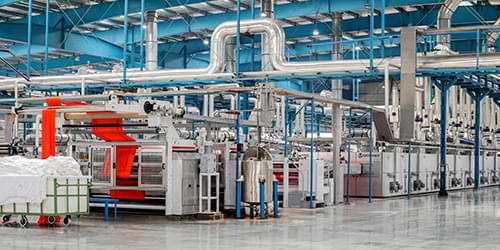 Industrial process plant interior with heat transfer equipment